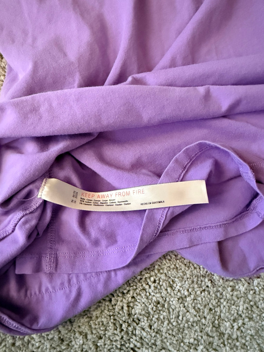 Free People Movement purple Hot Shot romper fabric care tag