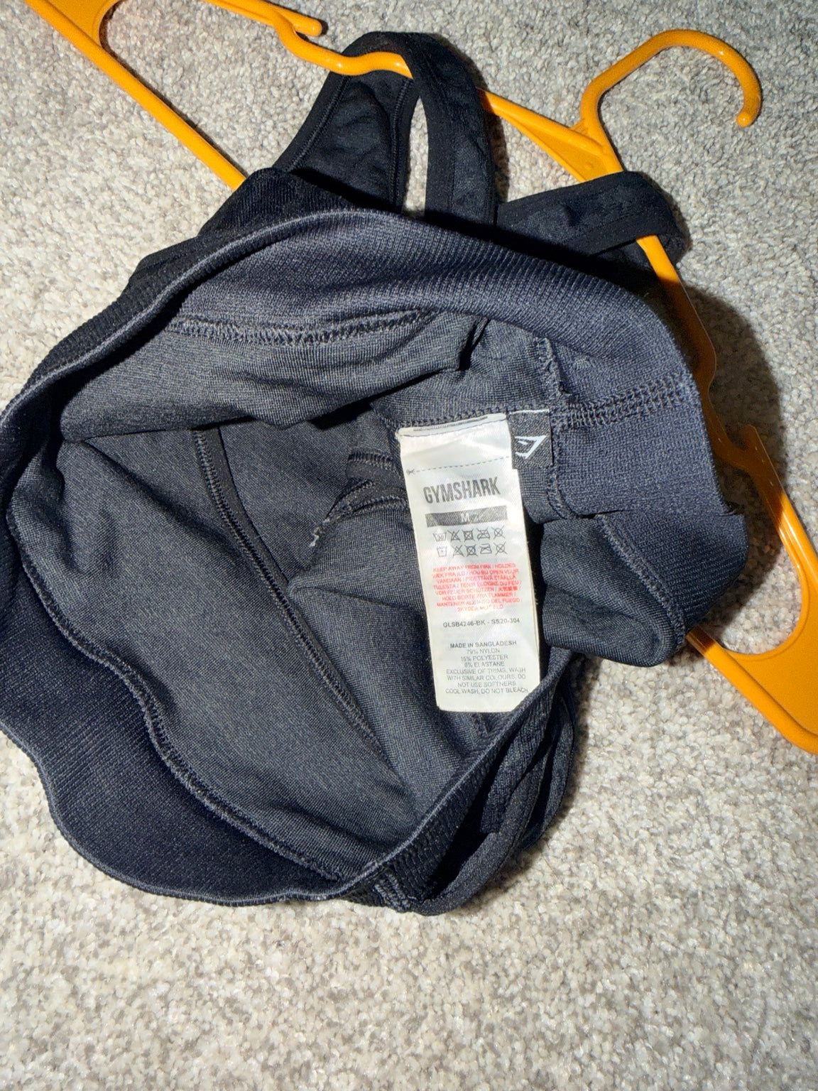 Gymshark black sports bra size M fabric and care label