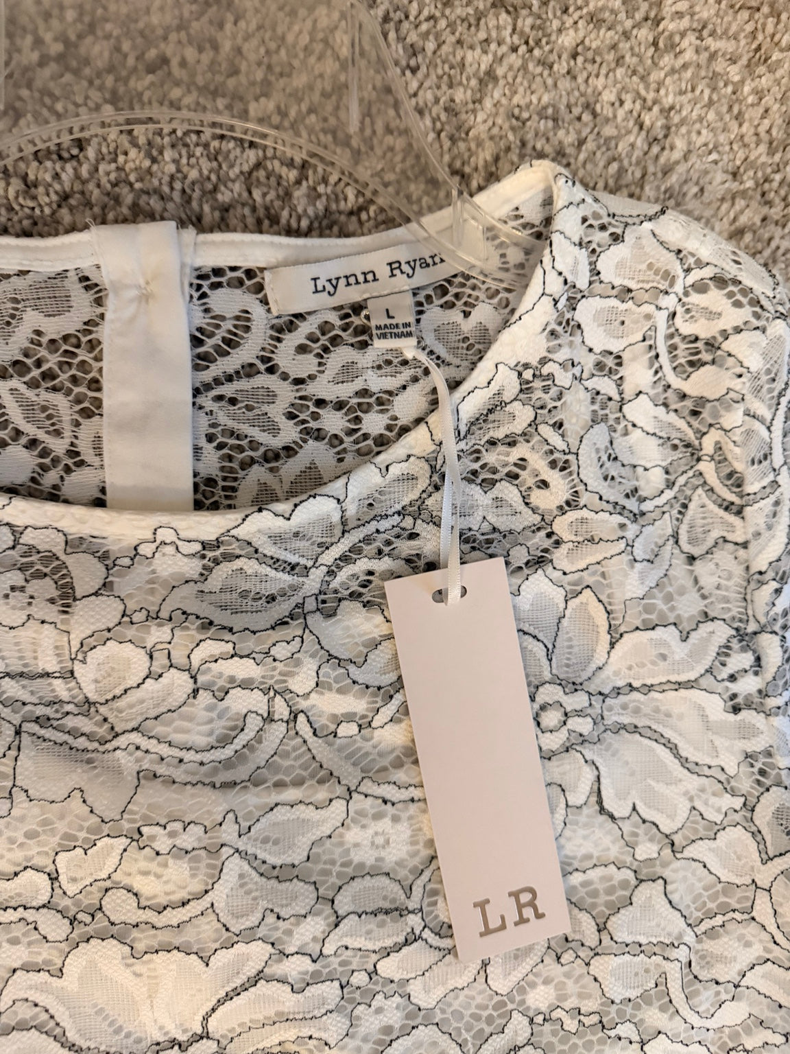 Lynn Ryan size L brand tag and new hang tag