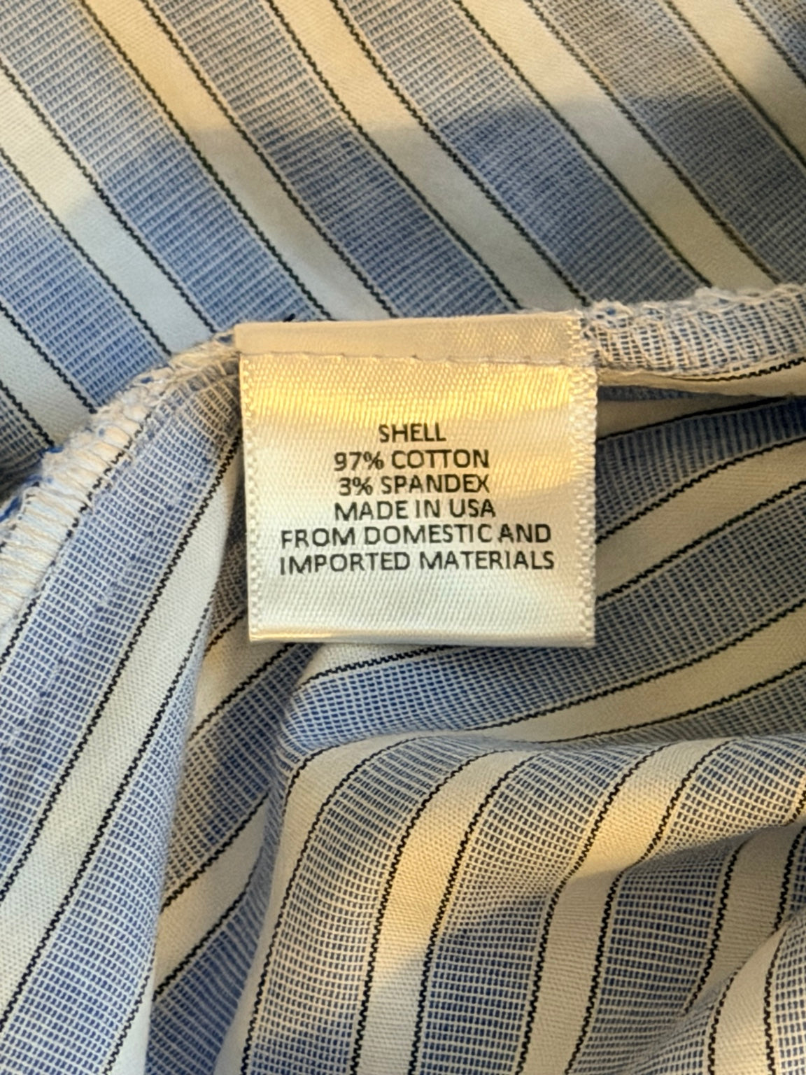 WAYF fabric tag showing 97 percent cotton and 3 percent spandex